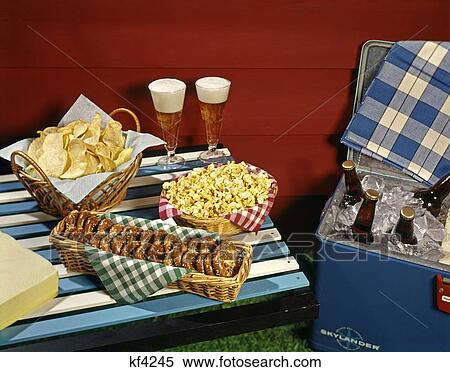 1950S 1960S Glass Bottles In Cooler Snacks Pretzels In Baskets 2 Pilsner Glasses Full Of Beer Foamy Head Picnic View Large Photo Image Stock Photography - 1950S 1960S Glass Bottles In Cooler Snacks Pretzels In Baskets 2 Pilsner Glasses Full Of Beer Foamy Head Picnic. Fotosearch