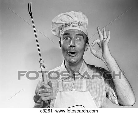 1950S 1960S Man Wear Chef Hat Toque Making Okay Sign Holding Bbq Grill Fork View Large Photo Image Stock Image - 1950S 1960S Man Wear Chef Hat Toque Making Okay Sign Holding Bbq Grill Fork . Fotosearch