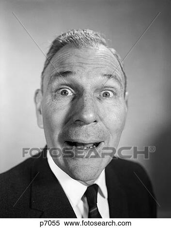 Stock Photography - 1950S 1960S Middle Aged Man Head Shot With Amazed Surprised Wacky Expression Face Elongated By Lens Distortion . Fotosearch