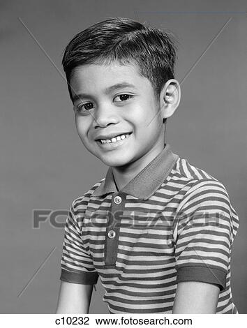 1950S 1960S Portrait Smiling Boy Ethnic Indonesian Indian Asian In Striped Tee Shirt View Large Photo Image Stock Image - 1950S 1960S Portrait Smiling Boy Ethnic Indonesian Indian Asian In Striped Tee Shirt . Fotosearch
