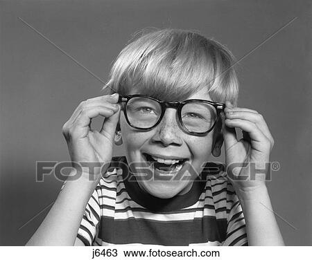1950S 1960S Smiling Laughing Boy Putting On Adult Eyeglasses View Large Photo Image Stock Image - 1950S 1960S Smiling Laughing Boy Putting On Adult Eyeglasses . Fotosearch