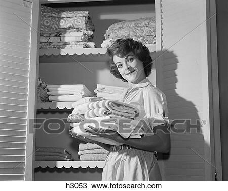 1950S 1960S Smiling Woman About To Put Fresh Linens Towels Laundry Into Linen Closet View Large Photo Image Stock Image - 1950S 1960S Smiling Woman About To Put Fresh Linens Towels Laundry Into Linen Closet . Fotosearch