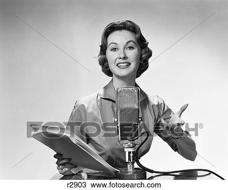 1950S 1960S Woman Announcer Reading From Papers Speaking Into Microphone View Large Photo Image Stock Image - 1950S 1960S Woman Announcer Reading From Papers Speaking Into Microphone . Fotosearch