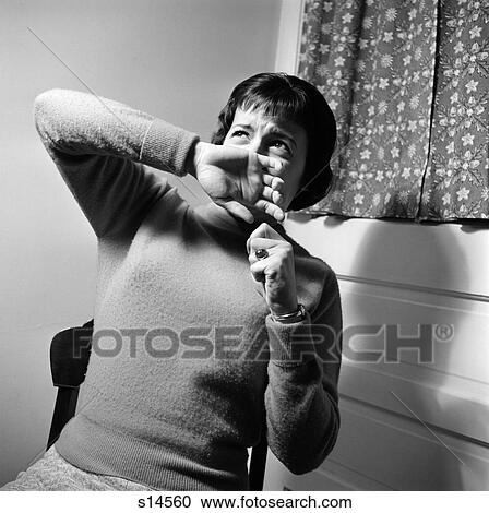 1950S 1960S Woman Hand Up To Face Cast Shadow On Wall Screaming Scream Terror Crime Violence Fear Expression Fright View Large Photo Image Stock Image - 1950S 1960S Woman Hand Up To Face Cast Shadow On Wall Screaming Scream Terror Crime Violence Fear Expression Fright . Fotosearch