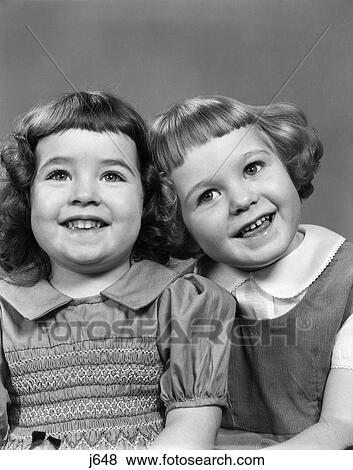 1950S 2 Girls With Bangs & Peter Pan Collars Dress & Corduroy Jumper Smiling Portraits Preschool Innocence Cute Playful View Large Photo Image Stock Photo - 1950S 2 Girls With Bangs & Peter Pan Collars Dress & Corduroy Jumper Smiling Portraits Preschool Innocence Cute Playful. Fotosearch