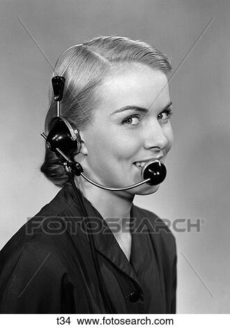1950S 3 4 Portrait Of Smiling Receptionist Wearing Headset View Large Photo Image Picture - 1950S 3 4 Portrait Of Smiling Receptionist Wearing Headset . Fotosearch