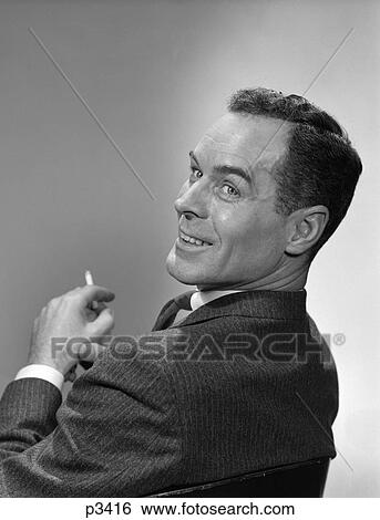 1950S 3 4 Profile Man Looking Over His Shoulder Cigarette In Hand Smiling View Large Photo Image Stock Photograph - 1950S 3 4 Profile Man Looking Over His Shoulder Cigarette In Hand Smiling . Fotosearch