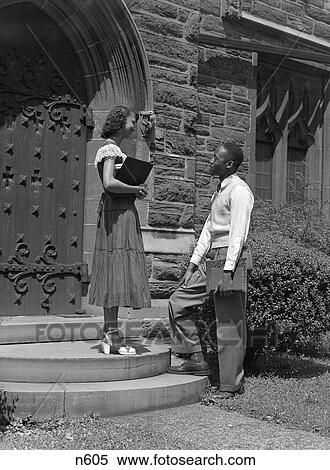 1950S African-American Couple Boy Girl On Steps Of College Campus Building Carrying Books Students View Large Photo Image Stock Photography - 1950S African-American Couple Boy Girl On Steps Of College Campus Building Carrying Books Students . Fotosearch