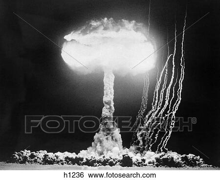 Stock Photograph -  1950S Atomic Test Showing The Blast And Mushroom Cloud At The Nevada Proving Grounds . Fotosearch