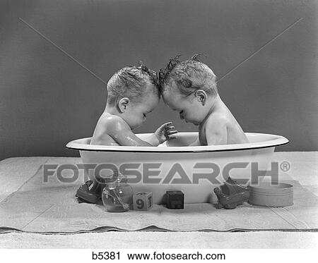 1950S Babies Head To Head In Metal Tub View Large Photo Image Stock Image - 1950S Babies Head To Head In Metal Tub . Fotosearch