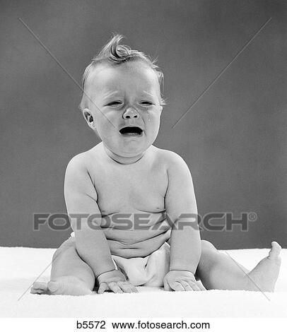 1950S Baby Seated With Distressed Expression & Tears Streaming Out Of Eyes View Large Photo Image Stock Image - 1950S Baby Seated With Distressed Expression & Tears Streaming Out Of Eyes . Fotosearch