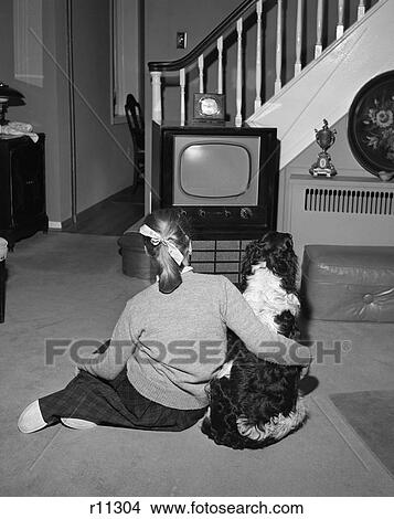 1950S Back View Of Teen Girl In Ponytail Watching Tv With Her Dog In Livingroom View Large Photo Image Picture - 1950S Back View Of Teen Girl In Ponytail Watching Tv With Her Dog In Livingroom . Fotosearch