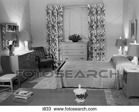 1950s Bedroom Interior With Floor Length Floral Curtains Venetian Blinds Chenille Bedspread 4 Table Lamps Stock Image