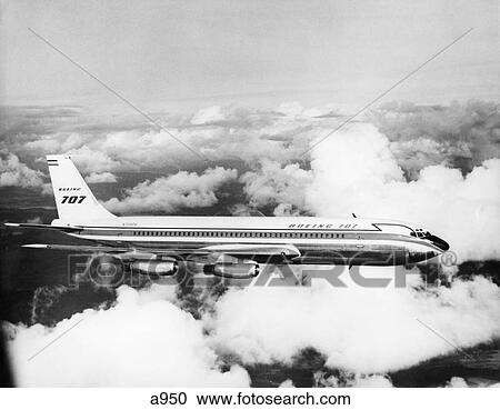 1950S Boeing 707 Passenger Jet Flying Through Clouds View Large Photo Image Stock Image - 1950S Boeing 707 Passenger Jet Flying Through Clouds . Fotosearch
