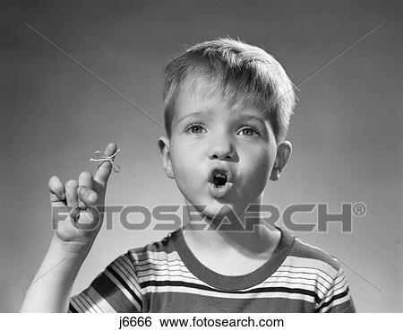 1950S Boy Funny Facial Expression Blonde String Tied To Finger To Remeber Not To Forget View Large Photo Image Stock Photograph - 1950S Boy Funny Facial Expression Blonde String Tied To Finger To Remeber Not To Forget . Fotosearch