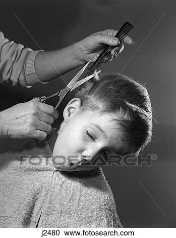 Stock Image - 1950S Boy Making Face As Hands Cut His Hair Barber Comb Scissors Hands Haircut . Fotosearch