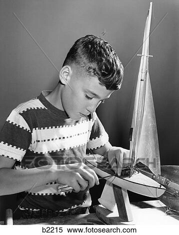 1950S Boy Working On Model Sailboat View Large Photo Image Stock Photography - 1950S Boy Working On Model Sailboat . Fotosearch