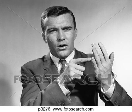 1950S Businessman Talking Gesturing With Hands Emphasizing Enumerating Number Items Points Itemizing Man View Large Photo Image Stock Photograph - 1950S Businessman Talking Gesturing With Hands Emphasizing Enumerating Number Items Points Itemizing Man . Fotosearch