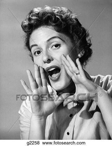 Stock Photo - 1950S Character Woman Shouting Hands Cupping Mouth Screaming Announcing Yelling . Fotosearch
