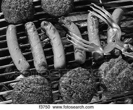 1950S Close-Up Of Grill Filled With Hot Dogs & Hamburgers & Tongs Reaching Down To Turn Them Over View Large Photo Image Stock Image - 1950S Close-Up Of Grill Filled With Hot Dogs & Hamburgers & Tongs Reaching Down To Turn Them Over . Fotosearch