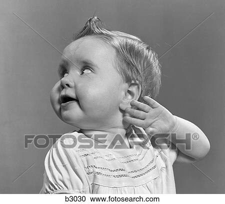 1950S Close-Up Portrait Of Baby Girl With Curl On Top Of Head Looking To Side With Arm Held Up Beside Ear View Large Photo Image Stock Image - 1950S Close-Up Portrait Of Baby Girl With Curl On Top Of Head Looking To Side With Arm Held Up Beside Ear . Fotosearch