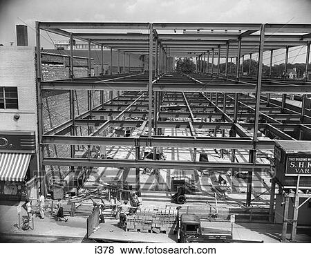 Stock Photo - 1950S Commercial Site Of Building Construction With Steel Girder Frame Erected Men Working Below. Fotosearch