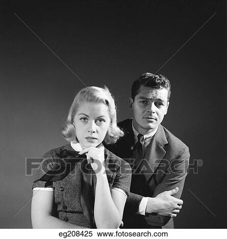 1950S Couple Man Blond Woman With Serious Puzzled Expressions Portrait View Large Photo Image Stock Photography - 1950S Couple Man Blond Woman With Serious Puzzled Expressions Portrait. Fotosearch