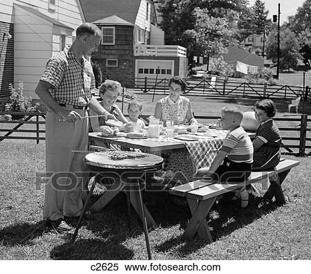 1950S Family In Backyard Cooking Hot Dogs View Large Photo Image Stock Photography - 1950S Family In Backyard Cooking Hot Dogs . Fotosearch