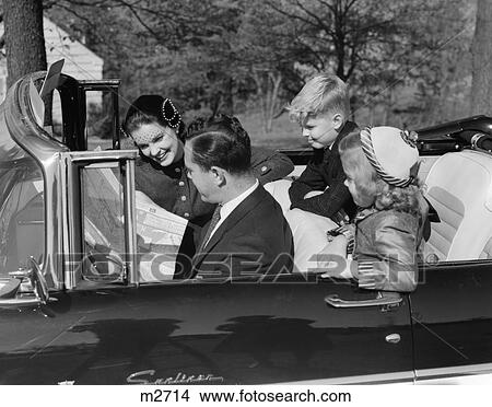 1950S Family In Convertible Reading Map View Large Photo Image Picture - 1950S Family In Convertible Reading Map . Fotosearch
