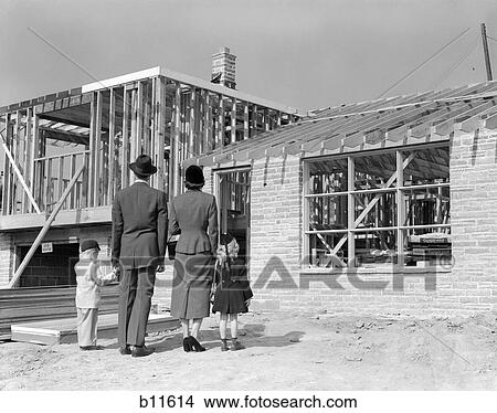 1950S Family Looking At New Home Under Construction View Large Photo Image Picture - 1950S Family Looking At New Home Under Construction . Fotosearch