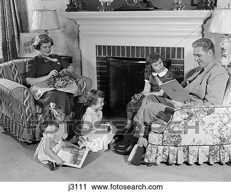 1950S Family Of Five Mother Father And Three Girls Sitting In Front Of Living Room Fireplace Mantle View Large Photo Image Stock Image - 1950S Family Of Five Mother Father And Three Girls Sitting In Front Of Living Room Fireplace Mantle . Fotosearch