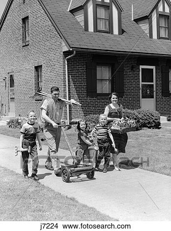 1950S Family Of Five On Suburban Sidewalk Walking With Gardening Tools Lawnmower & Flowers View Large Photo Image Picture - 1950S Family Of Five On Suburban Sidewalk Walking With Gardening Tools Lawnmower & Flowers . Fotosearch