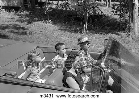 1950S Family Of Four Riding In Convertible Top Down Summer Outdoor View Large Photo Image Stock Image - 1950S Family Of Four Riding In Convertible Top Down Summer Outdoor . Fotosearch