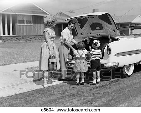 1950S Family Packing Trunk Of Car For A Picnic View Large Photo Image Picture - 1950S Family Packing Trunk Of Car For A Picnic. Fotosearch