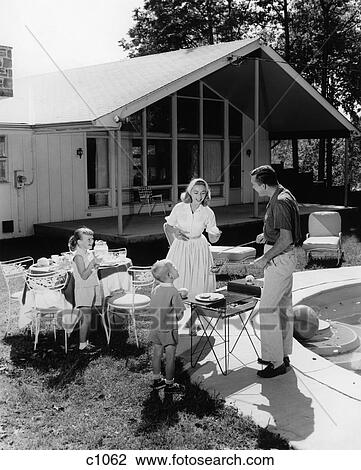 1950S Family Serving Hamburgers Beside Pool In Backyard Cookout View Large Photo Image Stock Image - 1950S Family Serving Hamburgers Beside Pool In Backyard Cookout . Fotosearch