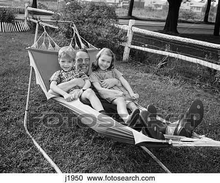 1950S Father Lying In Hammock Holding 2 Smiling Children Boy Girl View Large Photo Image Stock Image - 1950S Father Lying In Hammock Holding 2 Smiling Children Boy Girl . Fotosearch