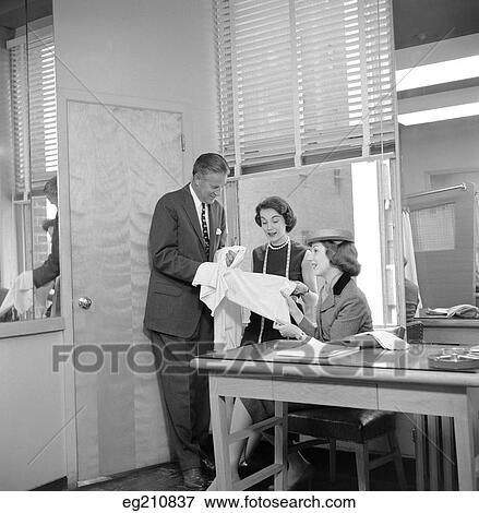 1950S Female Fashion Buyer Selecting Fabric In Garment Industry Showroom View Large Photo Image Stock Photo - 1950S Female Fashion Buyer Selecting Fabric In Garment Industry Showroom. Fotosearch