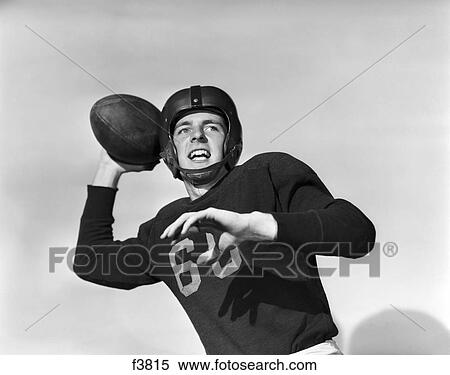 1950S Football Player Quarterback Arm Back About To Pass Ball Helmet Uniform Jersey Number 60 View Large Photo Image Stock Photography - 1950S Football Player Quarterback Arm Back About To Pass Ball Helmet Uniform Jersey Number 60 . Fotosearch