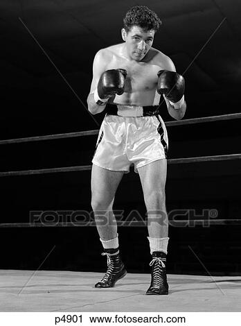 1950S Full Figure Boxer In Ring Facing Camera With Fists In Boxing Gloves View Large Photo Image Stock Image - 1950S Full Figure Boxer In Ring Facing Camera With Fists In Boxing Gloves . Fotosearch
