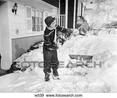1950S Girl In Cap Scarf Sweater Mittens & Winter Clothing Shoveling Snow Off Steps & Walkway Work View Large Photo Image Stock Photo - 1950S Girl In Cap Scarf Sweater Mittens & Winter Clothing Shoveling Snow Off Steps & Walkway Work . Fotosearch