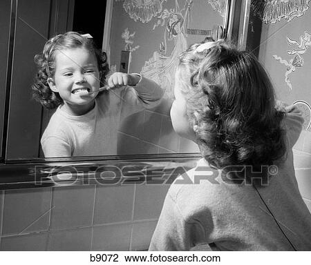 1950S Girl Looking In Mirror Brushing Teeth View Large Photo Image Stock Image - 1950S Girl Looking In Mirror Brushing Teeth . Fotosearch