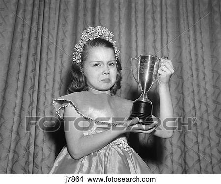 Picture - 1950S Girl Tiara Satin Dress Holding Up Trophy Award Crying Happiness Sad Second Place . Fotosearch
