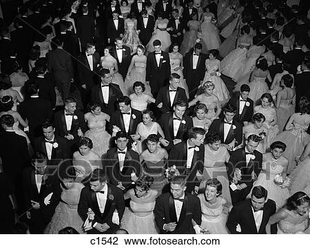 1950S Grand March At High School Prom Dance Promenade Teen Couples Formal Dress View Large Photo Image Stock Image - 1950S Grand March At High School Prom Dance Promenade Teen Couples Formal Dress . Fotosearch