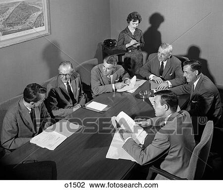 1950S Group Of Businessmen Having Meeting Around Table Female Secretary Takes Notes Indoor View Large Photo Image Stock Image - 1950S Group Of Businessmen Having Meeting Around Table Female Secretary Takes Notes Indoor . Fotosearch
