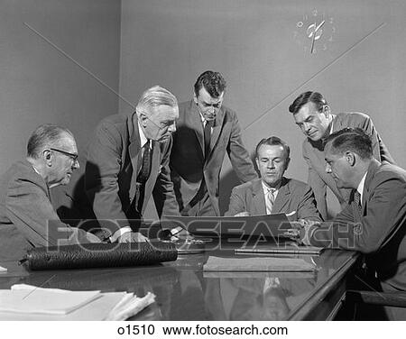 Stock Image - 1950S Group Of Six Men Around A Chart . Fotosearch