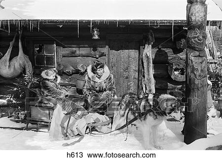 1950S Hunters Hunting Cabin In Snow Man Dog Sled With Little Girl Trapper Fur Vintage View Large Photo Image Stock Image - 1950S Hunters Hunting Cabin In Snow Man Dog Sled With Little Girl Trapper Fur Vintage . Fotosearch