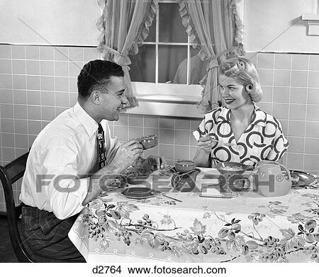 1950S Husband And Wife At Breakfast Eating Cereal & Drinking Coffee View Large Photo Image Picture - 1950S Husband And Wife At Breakfast Eating Cereal & Drinking Coffee . Fotosearch