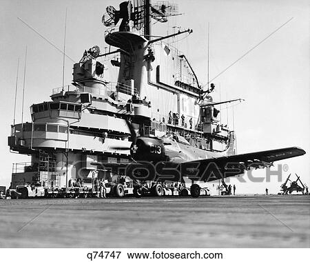 1950S Launching Attack Bomber Airplane From Deck Of Aircraft Carrier During Korean War Uss Kearsarge Navy Ship View Large Photo Image Stock Photo - 1950S Launching Attack Bomber Airplane From Deck Of Aircraft Carrier During Korean War Uss Kearsarge Navy Ship. Fotosearch