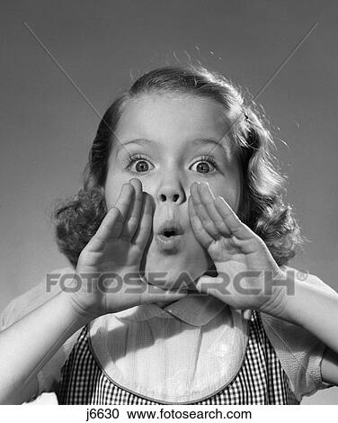 Stock Image - 1950S Little Girl Hand Cupping Mouth To Shout Yell Whistle Facial Expression Secret Gossip . Fotosearch
