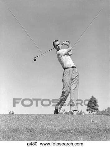 1950S Man Golfer Club Raised About To Take Full Swing Stance Position Hole Tee Ball View Large Photo Image Stock Image - 1950S Man Golfer Club Raised About To Take Full Swing Stance Position Hole Tee Ball . Fotosearch